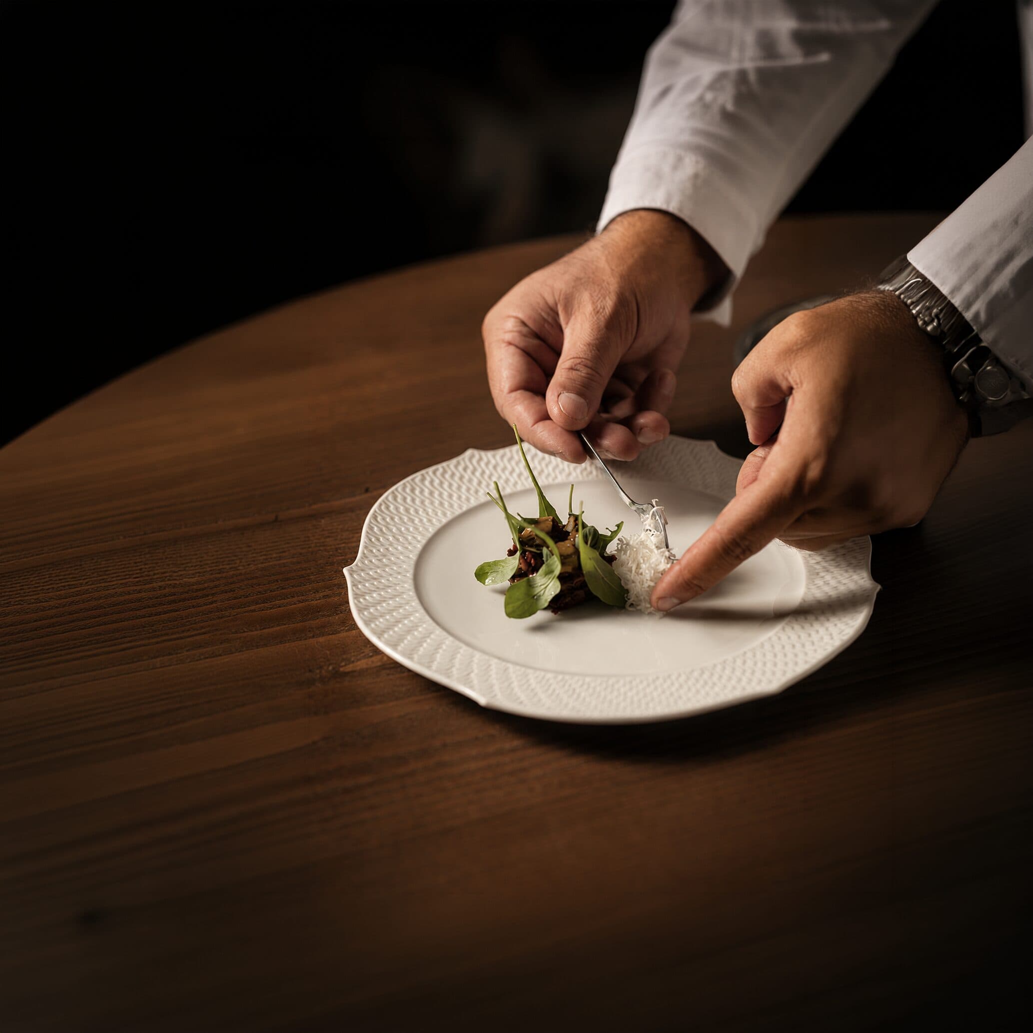 A NOR concierge attending to a guest with white-glove service.