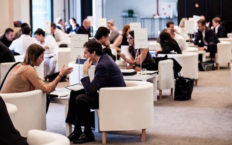 Attendees networking at a corporate reception.