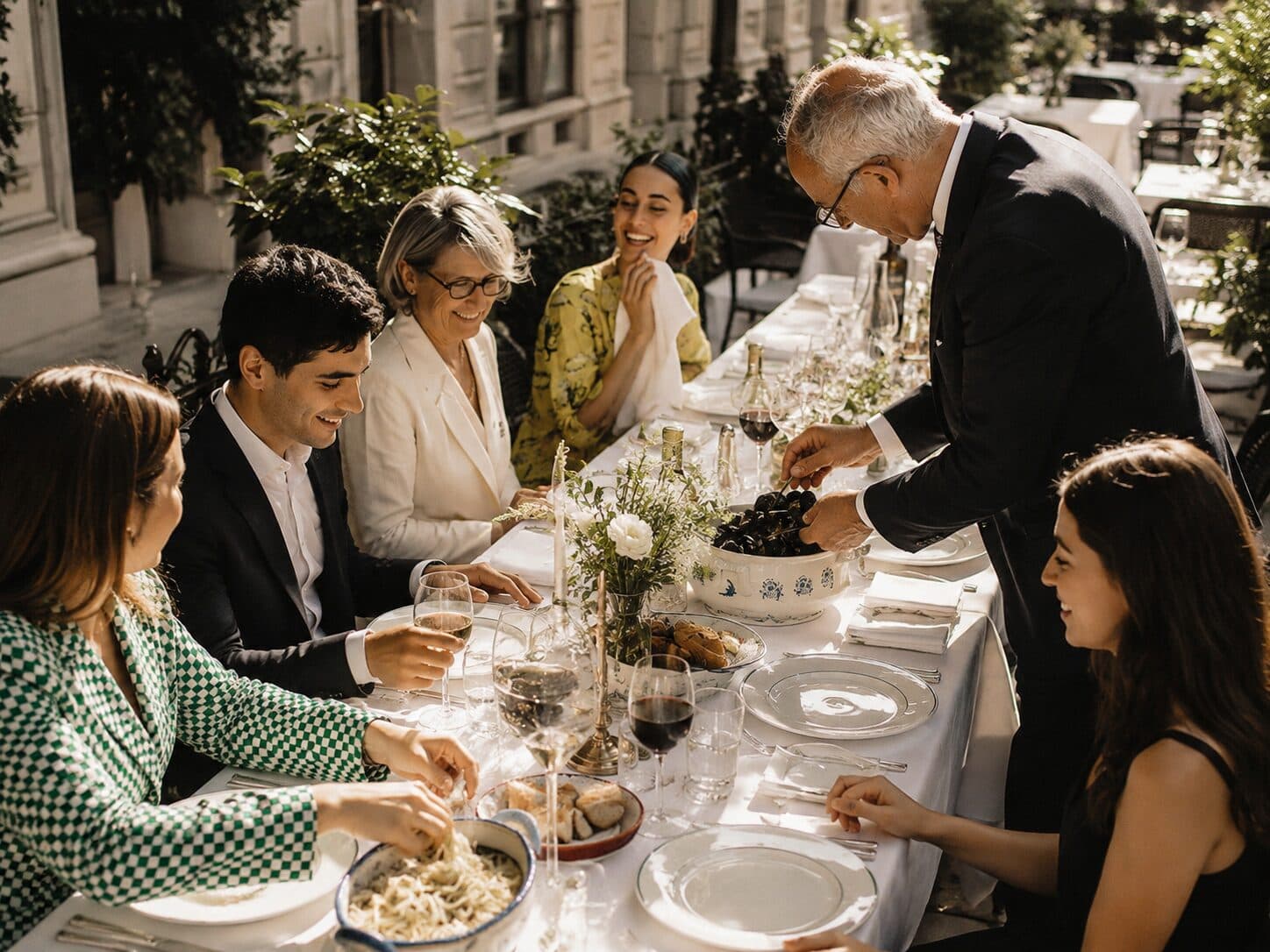 A family-style dinner served at an outdoor personal celebration.